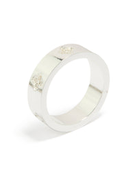 Designed with waterproof stainless steel and cubic zirconia floral feature in silver and white, dainty band ring side detail view - link has visual effect only
