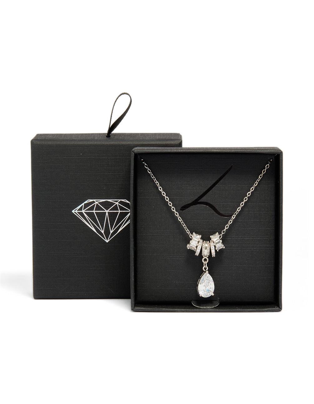 Exquisite silver cubic zirconia pear rondelle necklace featuring charm pendant with crystal accents close up view