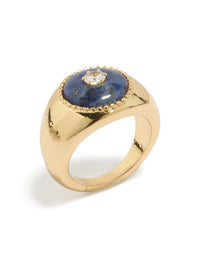 Featuring a gold plated chunky cubic zirconia blue stone ring with statement design side detail view - link has visual effect only