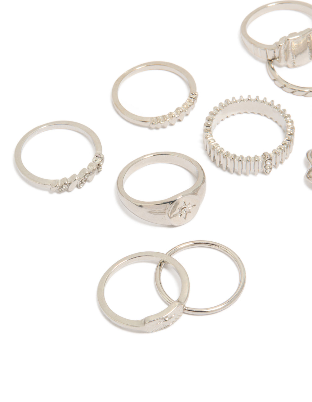 Crafted from silver, this signet and ribbed rings 10-pack with celestial star accents in dainty statement design close up view