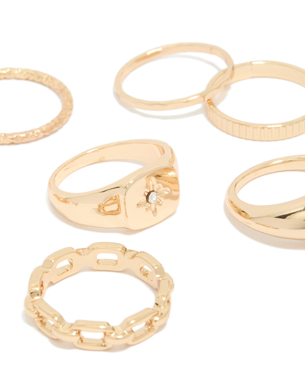 Highlighting a celestial dainty ring collection with star accents in gold close up view
