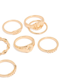Crafted from gold, statement signet and ribbed rings with celestial star in a 10-pack side detail view - link has visual effect only