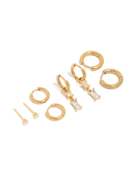 Showcasing waterproof gold plated stainless steel huggie and stud earrings in a 4-pack featuring baguette cut cubic zirconia crystals front view - link has visual effect only