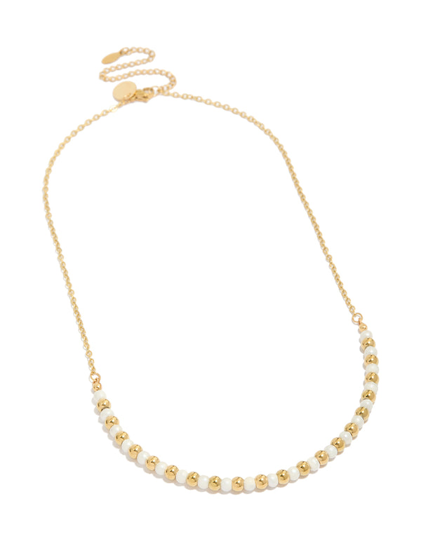 Stunning waterproof beaded necklace with alternating gold plated stainless steel balls and pearl front view