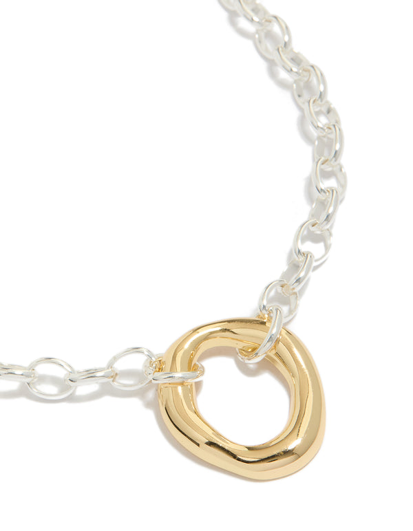 Showcasing a waterproof mixed metal plated stainless steel organic round necklace crafted from gold and silver close up view