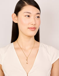 Beautifully crafted waterproof gold plated stainless steel pink tulips pendant necklace with floral in dainty style on model view - link has visual effect only