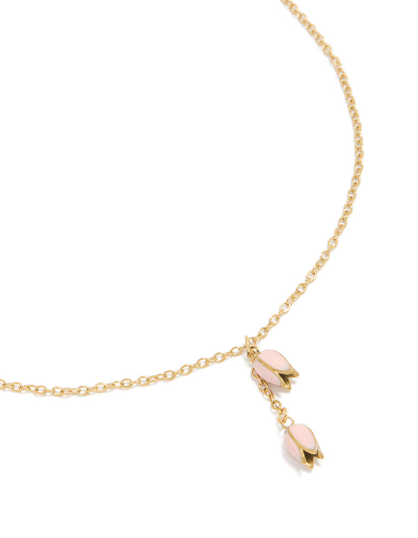 Showcasing a charm floral necklace crafted from waterproof stainless steel with gold plated finish in pink, dainty close up view