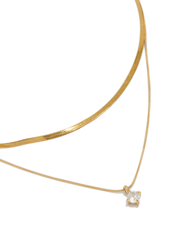Beautifully styled waterproof layered necklace featuring a snake chain, round cubic zirconia, and a dainty gold plated stainless steel design, on neck view