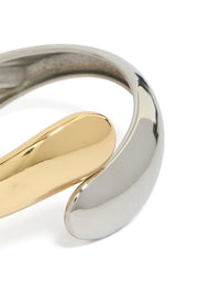 Crafted from waterproof mixed plated stainless steel round twisted cuff bangle in silver and gold with chunky styling close up view - link has visual effect only