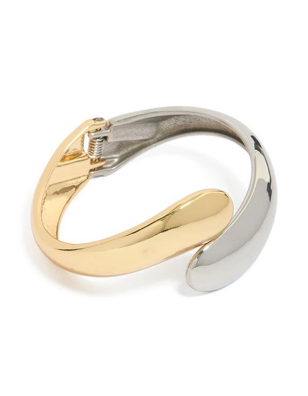 Showcasing a waterproof mixed plated stainless steel round twisted cuff bangle in silver and gold with chunky styling front view