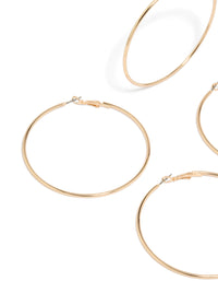 Crafted from gold large hoop earrings 2-pack featuring statement design close up view - link has visual effect only