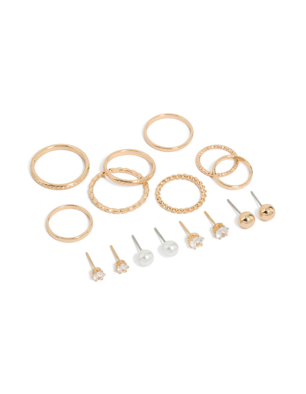 Showcasing dainty stud earrings featuring pearl and ball designs, along with rings in a 12-piece set with a gold finish front view