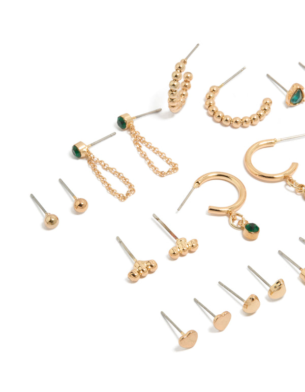 Discover gold green diamante stud earrings 12-pack with balls, pearl and heart details, huggie closures in white and gold tones close up view