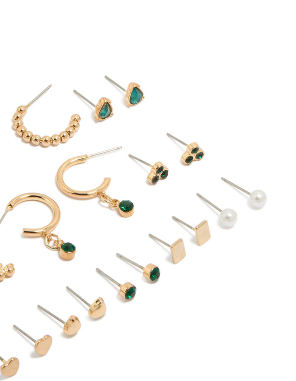 Discover gold green diamante stud earrings 12-pack with balls, pearl and heart details, huggie closures in white and gold tones close up view