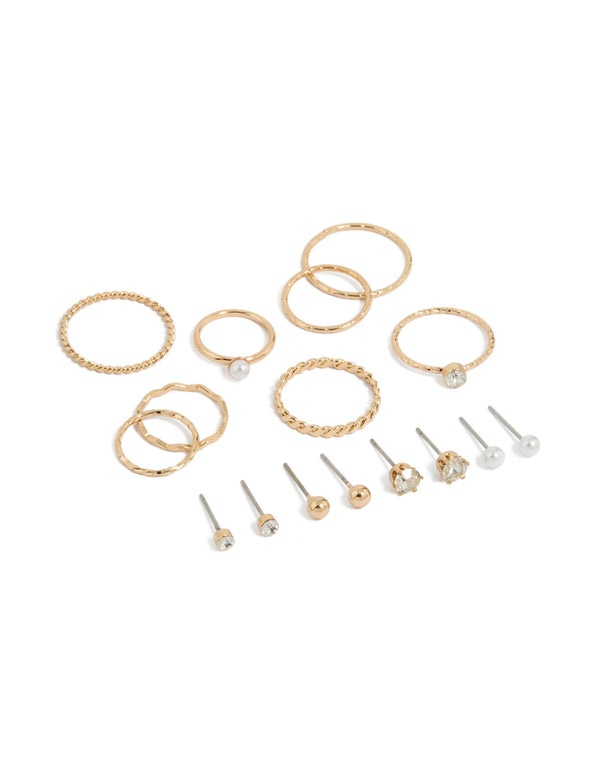 Showcasing dainty stud earrings featuring pearl and ball designs, along with rings in a 12-piece set with a gold finish front view