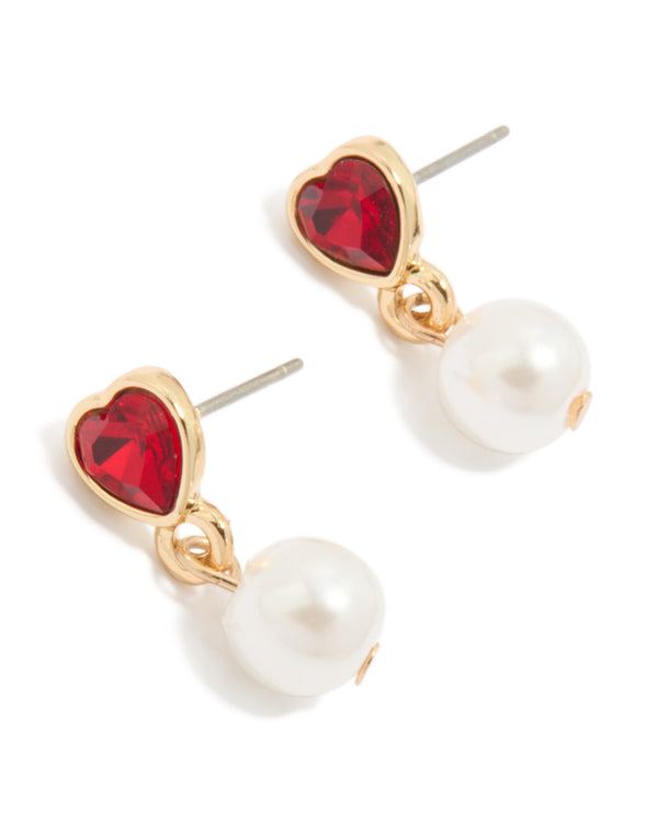 Showcasing gold stud earrings featuring red diamante heart with white pearl drop front view