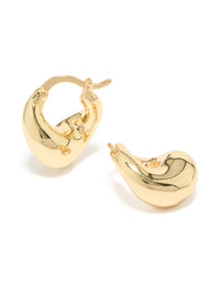 Discover these statement wavy hoop earrings crafted from gold plated material in a beautiful gold color front view - link has visual effect only