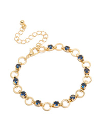 Elegant gold plated bracelet featuring blue cubic zirconia in round cut with alternating link design front view - link has visual effect only