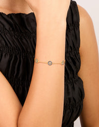 Elegant gold plated evil eye station bracelet on wrist view - link has visual effect only