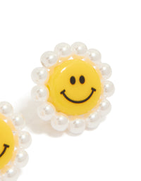 These floral stud earrings with pearl accents in yellow and white acrylic post detail view - link has visual effect only