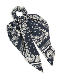Featuring a paisley printed scarf scrunchie in black and ivory with statement style front view - link has visual effect only