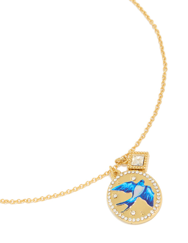 Showcasing gold plated stainless steel diamante and enamel bird charm pendant necklace in blue with waterproof features front view