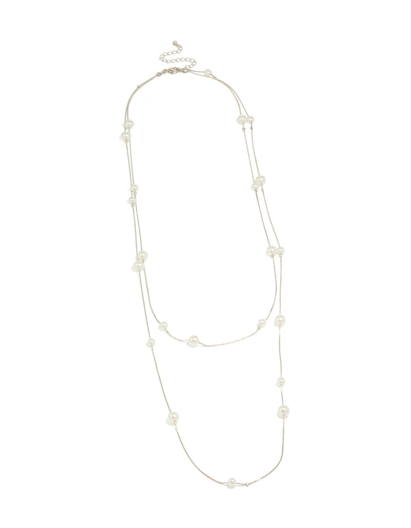 Featuring this silver pearl layered necklace in ivory front view