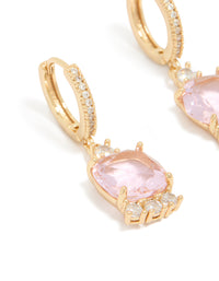 Highlighting gold pink cubic zirconia square huggie earrings in statement style with clear accents close up view - link has visual effect only