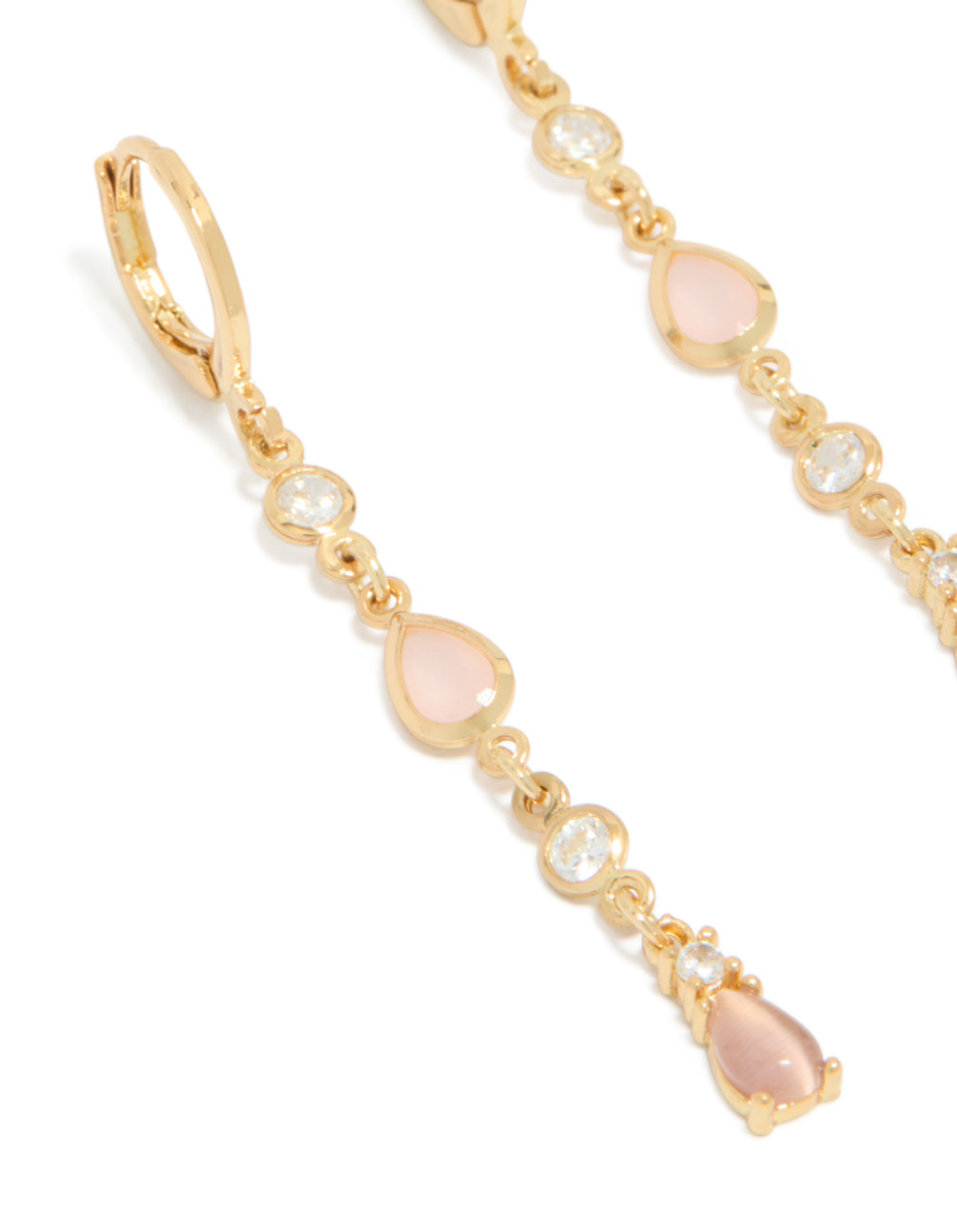 Discover gold plated cubic zirconia trio and pink catseye drop huggie earrings close up view