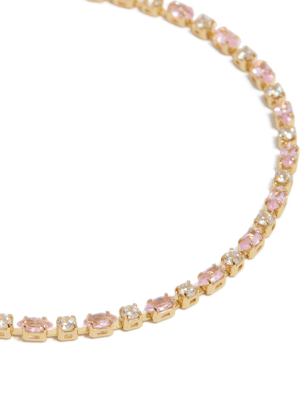 Elegant tennis bracelet crafted from gold plated material with pink and clear cubic zirconia stones close up view