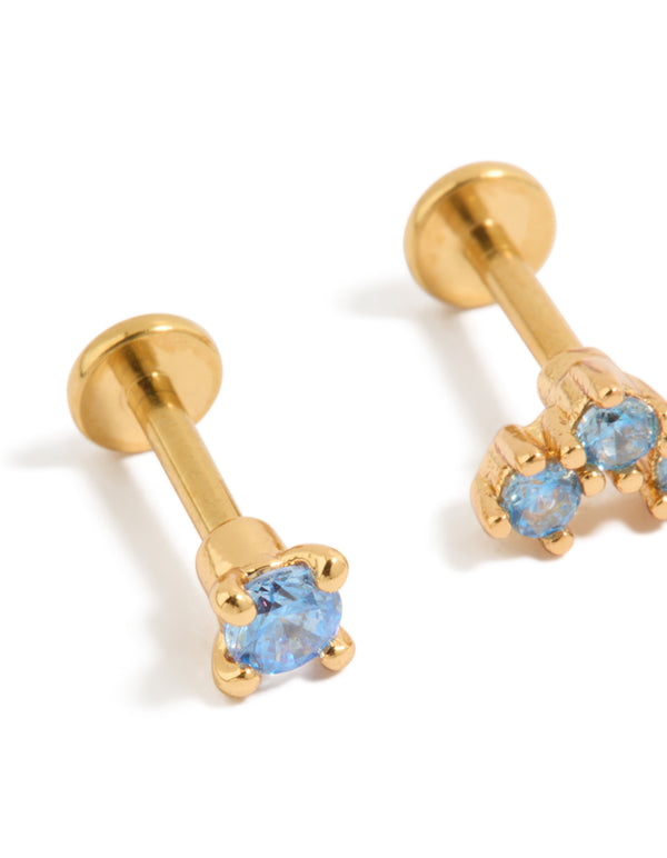 Stunning gold plated titanium flat back studs with blue cubic zirconia crystals close up view