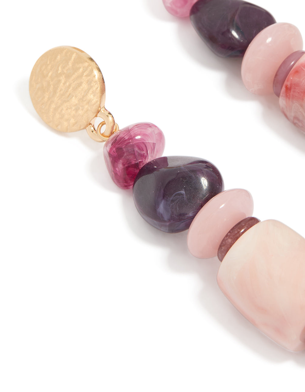 Designed with statement drop earrings featuring irregular pink beads, purple accents, stud closure, and gold finish close up view