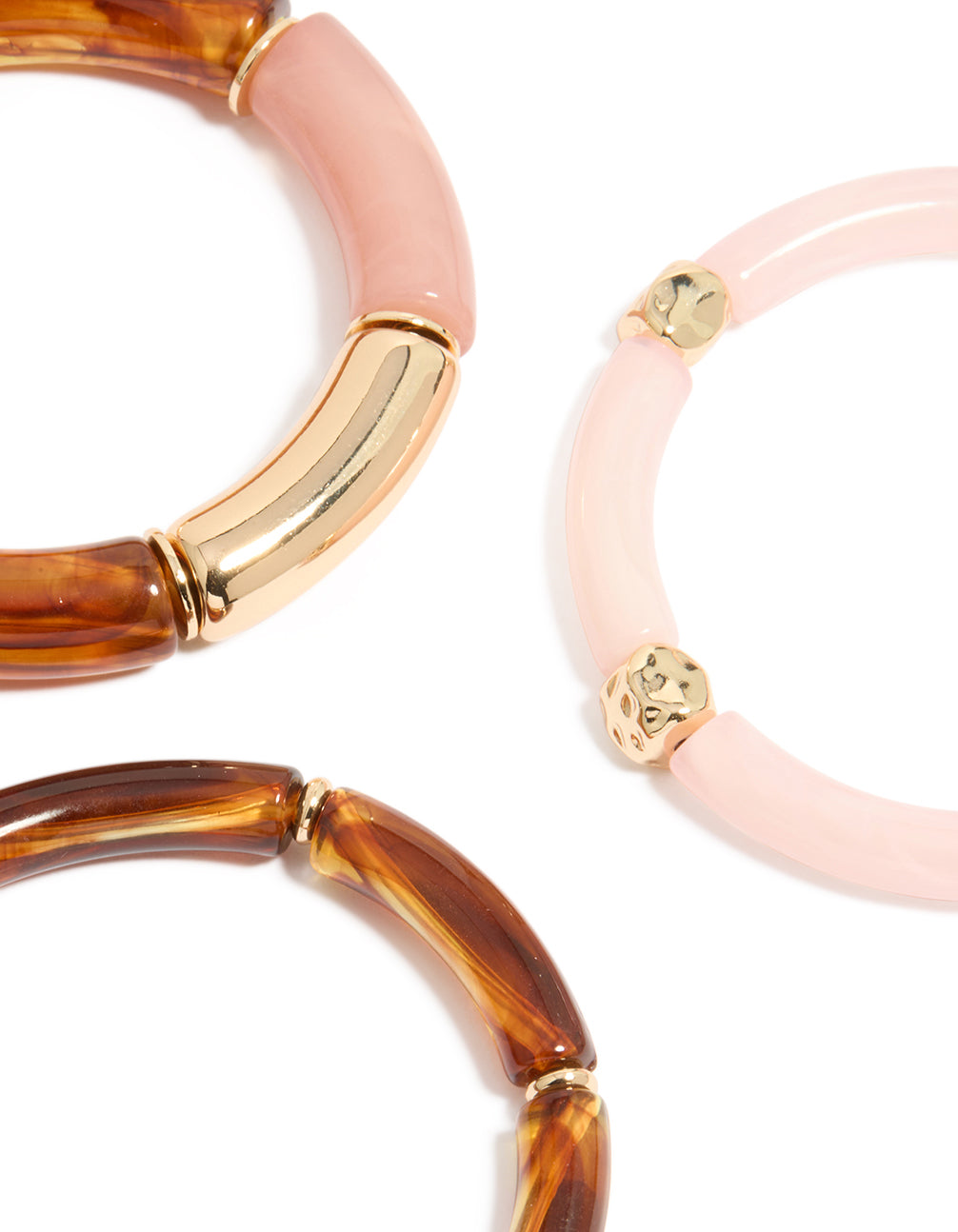 Highlighting mixed pink resin and gold stretch bracelets with beaded design details in a 3-pack close up view