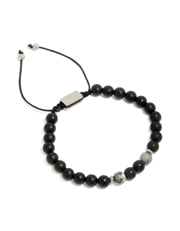 Showcasing a mens waterproof black beaded toggle bracelet with stainless steel accents in grey and silver front view
