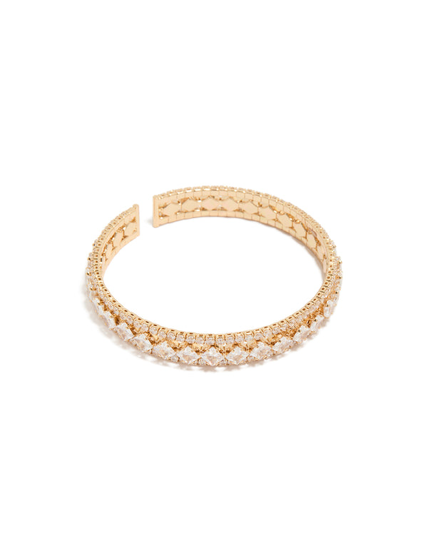 Showcasing a gold cubic zirconia circle statement cuff bangle front view