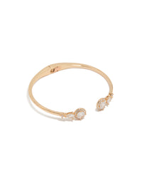 Showcasing a gold cubic zirconia hinged circle open front wrist cuff bracelet front view - link has visual effect only