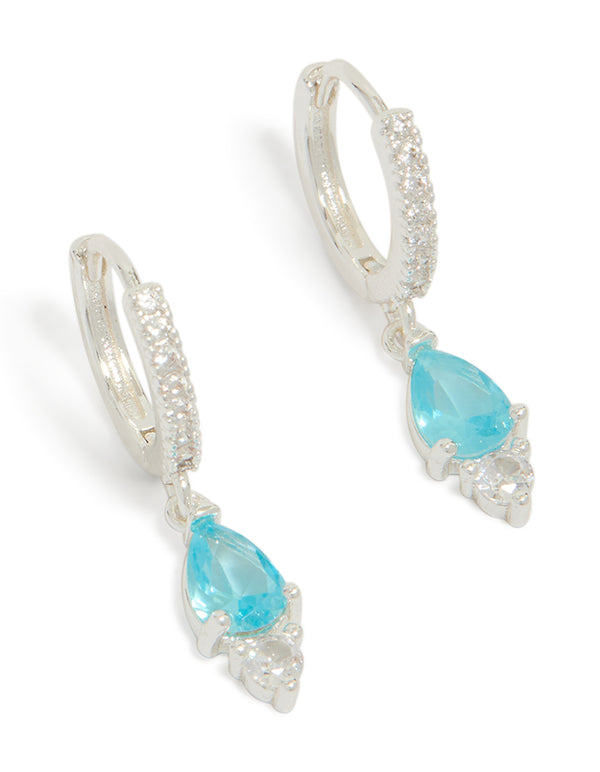 Elegant silver plated cubic zirconia blue huggie drop earrings featuring crystal accents with hoop closure in aqua front view