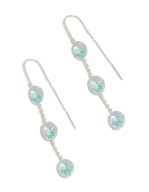 Showcasing silver plated blue stone thread through earrings with pale turquoise details front view