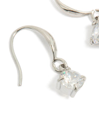 Featuring waterproof stainless steel sleek drop earrings with round cut cubic zirconia in silver and clear close up view - link has visual effect only