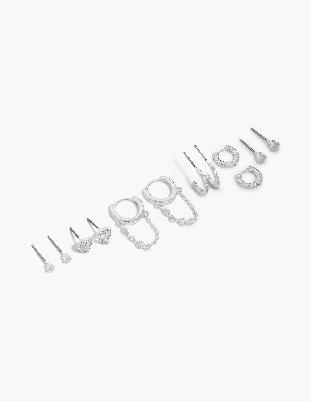 Showcasing silver plated cubic zirconia heart chain stud earrings 6-pack featuring huggie closure in silver front view