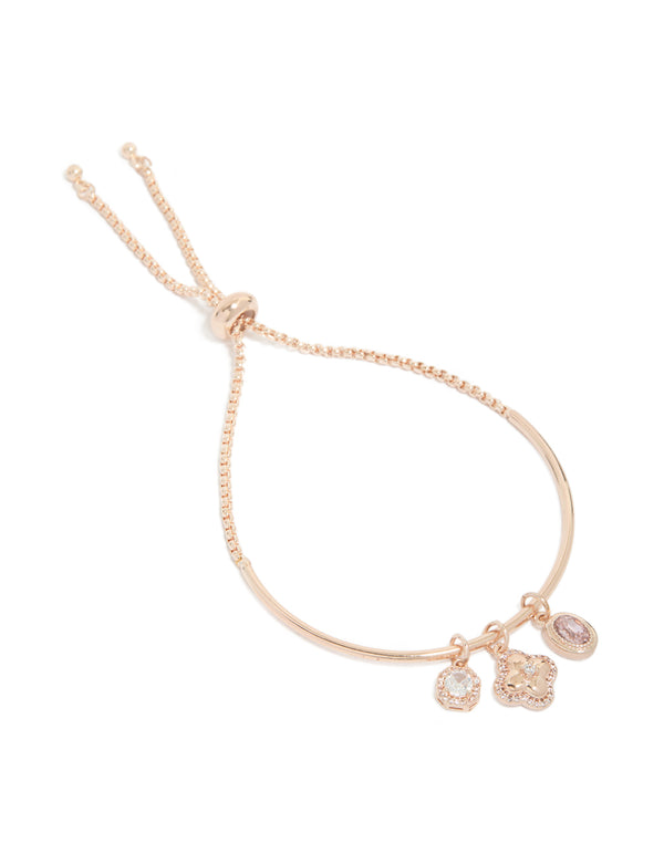 Elegant floral charm toggle bangle crafted from rose gold plated material with cubic zirconia in pink and rose gold tones front view