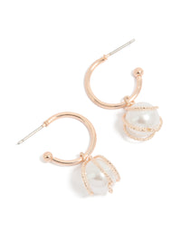Showcasing rose gold pearl wire wrap hoop earrings front view - link has visual effect only