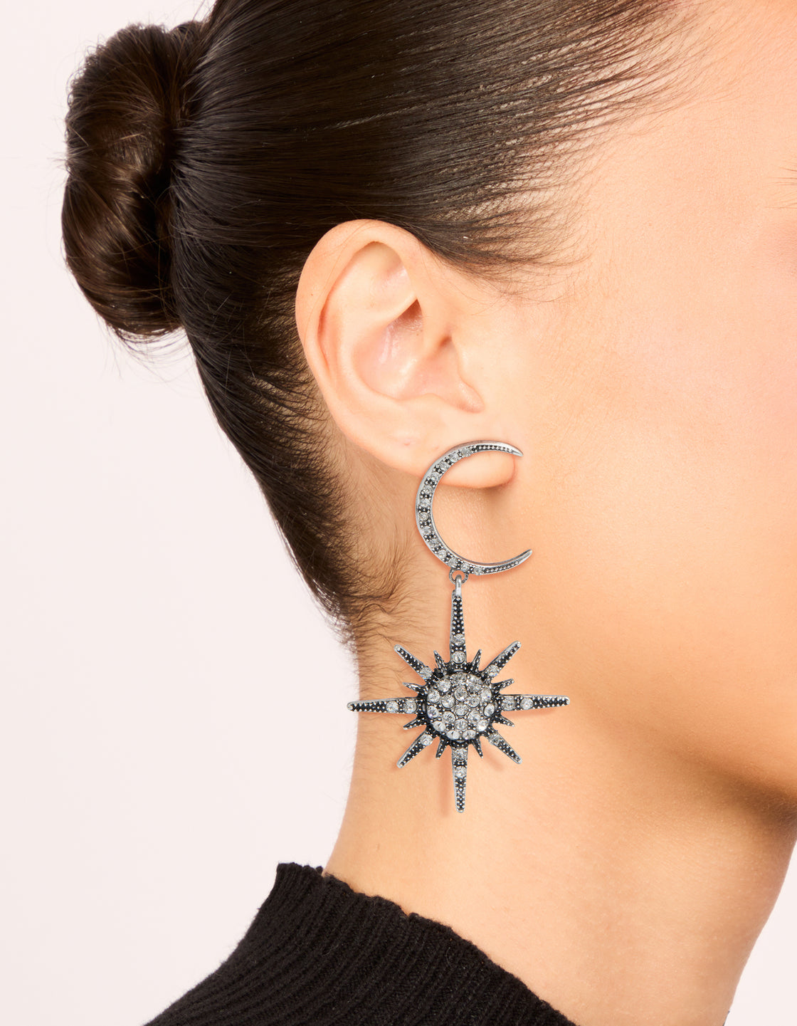 Antique silver diamante moon drop earrings with celestial design on ear view