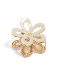 Showcasing a gold iridescent flower outline claw clip front view - link has visual effect only