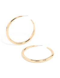 Showcasing gold thin plain hoop earrings with closure in front view - link has visual effect only