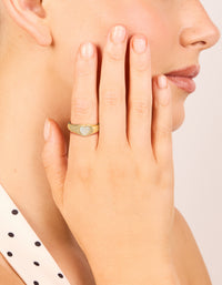 Displaying a gold plated stainless steel dainty heart signet ring with waterproof material on finger view - link has visual effect only