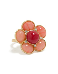 Showcasing a statement flower ring crafted from gold plated material featuring pink stone in coral, crimson, and clear front view - link has visual effect only