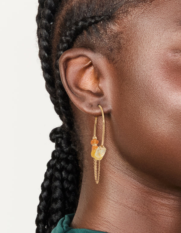 Elegant orange chip and gold chain hoop earrings with beads on ear view