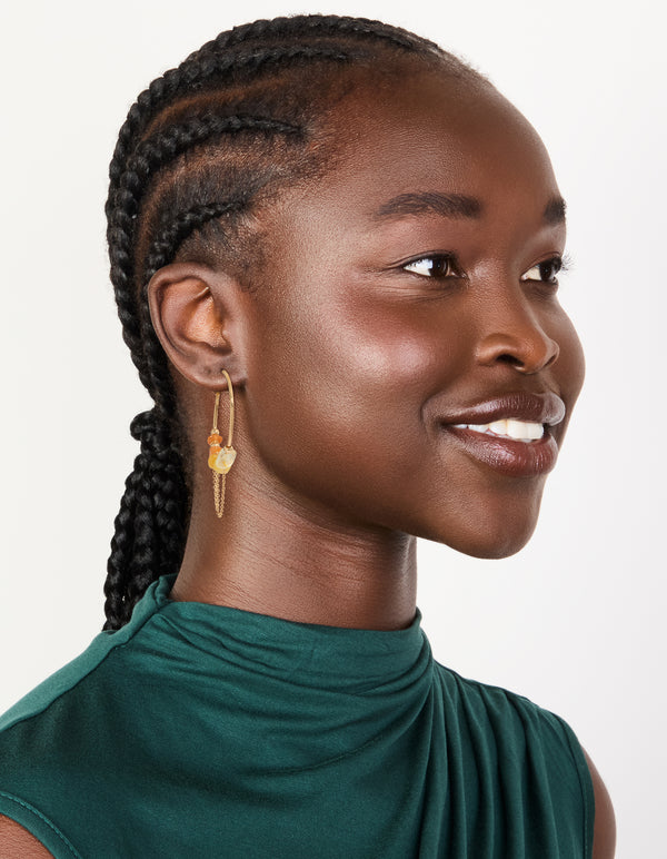 Presenting orange chip and gold chain hoop earrings with beads on model view
