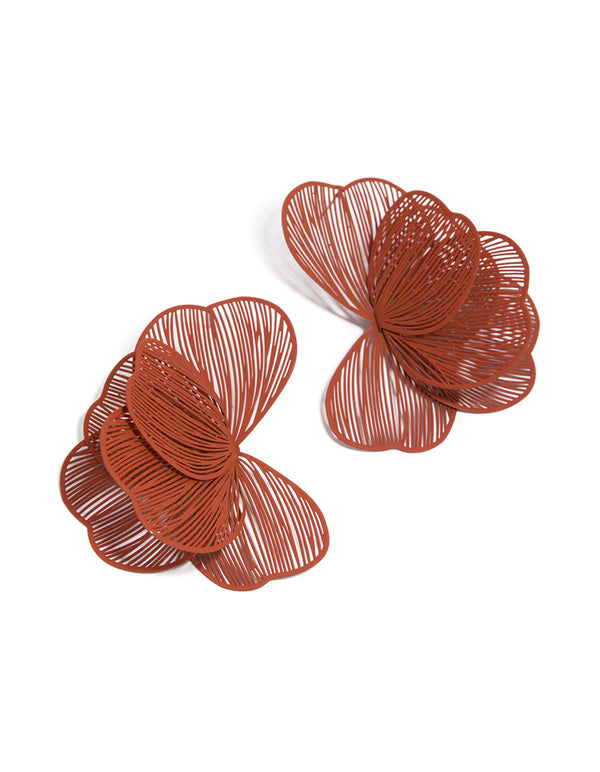 Showcasing coated wire orange petal stud earrings with floral design in sienna front view